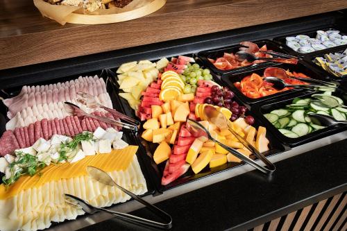 a tray of different types of food on a table at Vinařský penzion André in Velké Pavlovice