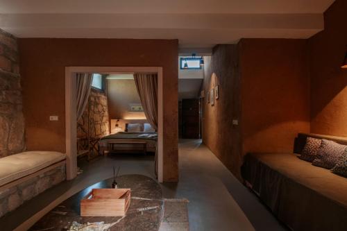 a living room with a couch and a table at MANEJ URLA in Izmir