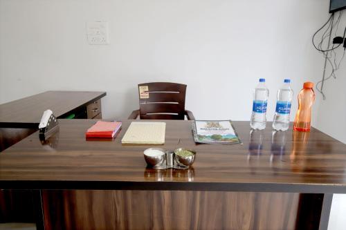 an office desk with bottles of water on it at Narayani Bag Resort & Restaurant 