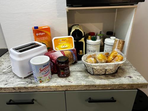 a kitchen counter with food and other items on it at Las Arcas, cómodo apartamento cerca del centro in Valladolid