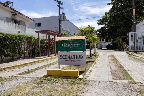 a sign on the side of a street at Scenarium Hotel in Recife