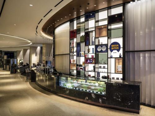 a lobby of a hotel with a display of cosmetics at Novotel Suites Ambassador Seoul Yongsan in Seoul