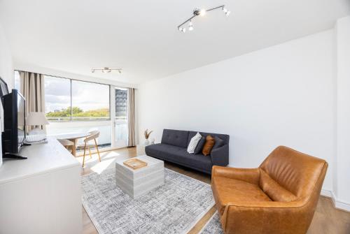 a living room with a couch and a chair at Marylebone in London