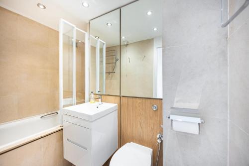 a bathroom with a toilet and a sink and a shower at Marylebone in London