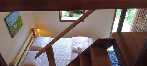 an overhead view of a staircase in a room at Chalé Refúgio dos Gnomos in Visconde De Maua