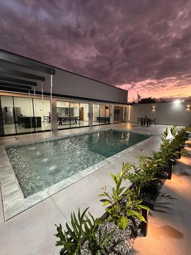 a large swimming pool in the middle of a building at Aruanã - Casa Sol in Aruanã in Aruanã