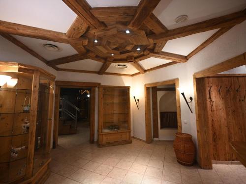 a large room with wooden ceilings and wooden cabinets at Mercure Sighisoara Binderbubi Hotel & Spa in Sighişoara