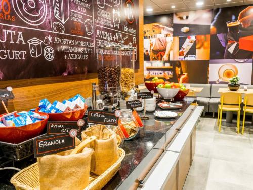 a grocery store with a counter with bags of food at ibis Copiapo in Copiapó