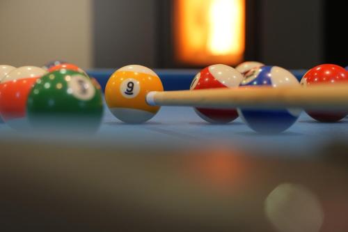 a group of billiard balls on a table at La Forge - Chambres d'hôtes en Ardenne in Wellin