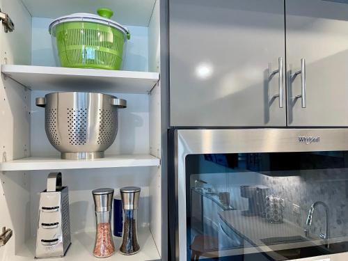 a kitchen with a refrigerator with a mixer and utensils at Elevator-Work Here-Gig WiFi-King Bed-Laundry in unit in Walnut Creek