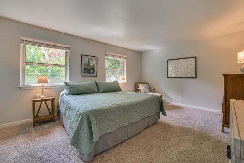 a bedroom with a bed and two windows at Harbor Springs Winter Retreat about 6 Mi to Skiing! in Harbor Springs