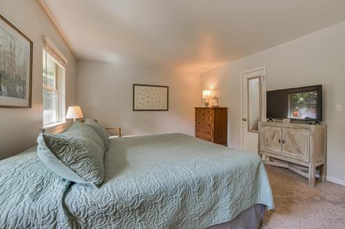 a bedroom with a bed and a flat screen tv at Harbor Springs Winter Retreat about 6 Mi to Skiing! in Harbor Springs