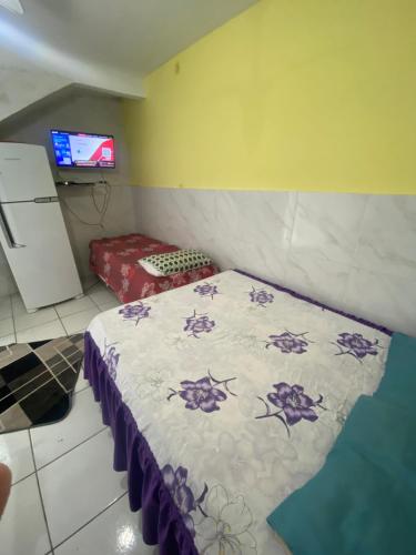 Postel nebo postele na pokoji v ubytování Kitnet espaçosa para casais