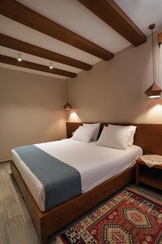 Ein Bett oder Betten in einem Zimmer der Unterkunft Palorto Hotel