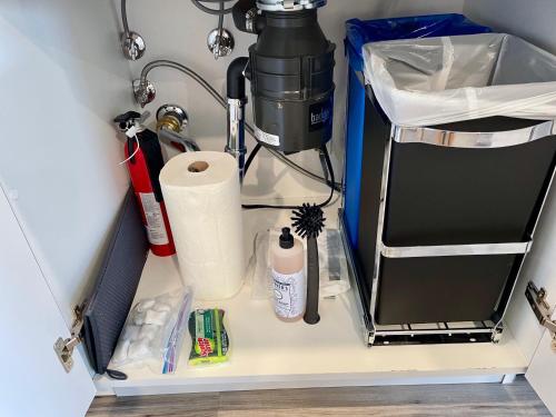 a shelf with a coffee maker and toilet paper at Bright Top Floor-Elevator-Walk Downtown-Laundry in Walnut Creek