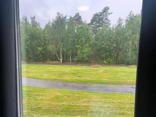 a view of a field from a window at Rentalux Apartment Rooms in Timrå