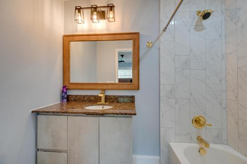 a bathroom with a sink and a mirror at 5 Mi to Lake Thom-A-Lex Pet-Friendly Retreat in Thomasville