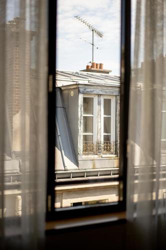 a view from a window of a building at Hotel Bachaumont in Paris