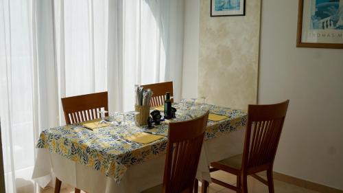 a dining room table with a table cloth on it at Hotel Europa in Misano Adriatico