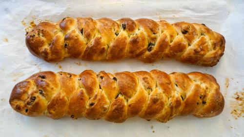 two long breadsticks sitting on top of a table at Hotel Europa in Misano Adriatico