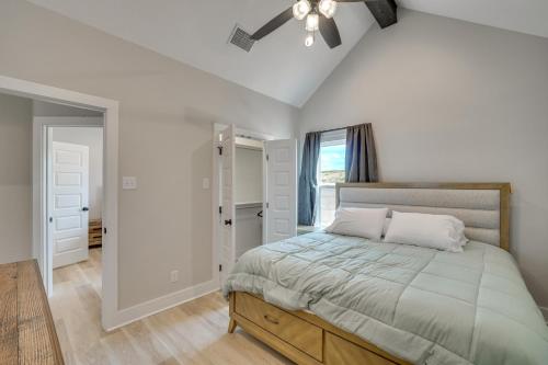 a bedroom with a bed and a ceiling fan at Brand-New Home 2 Mi to Shannon Med Center! in San Angelo