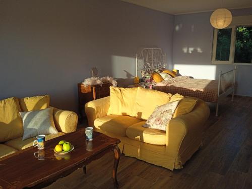 a living room with a couch and a table at ART HOUSE Kosmaj 2 in Sopot