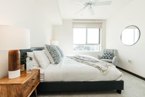 a bedroom with a bed and a desk and a window at Stylish Vibes 1BD in WEHO in Los Angeles