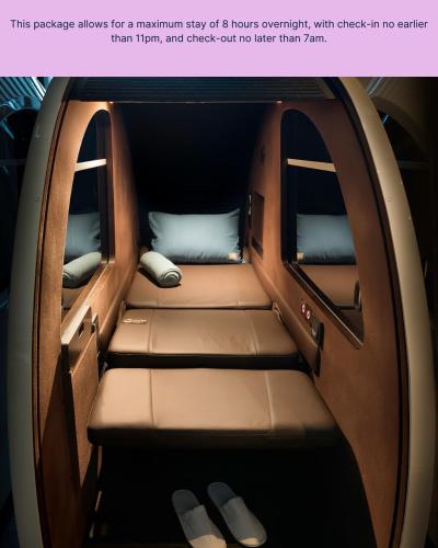 a seat in the back of a car with two windows at Sleepover Terminal 3, Concourse A - formerly sleep 'n fly in Dubai