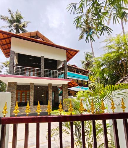 a view of the house from the beach at Happy Buddha Varkala in Varkala