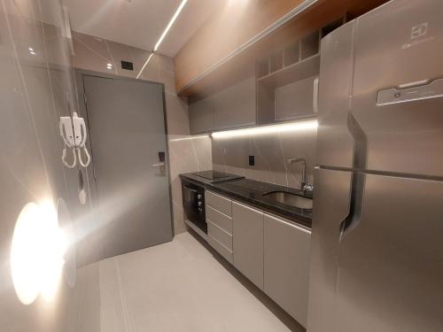 Cuisine ou kitchenette dans l'établissement V-Home Flat Hotel
