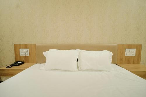 Postel nebo postele na pokoji v ubytování the Vibez Inn Hotel