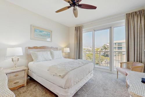 a bedroom with a bed and a large window at High Pointe W31 - Gulf Front Condo in Inlet Beach
