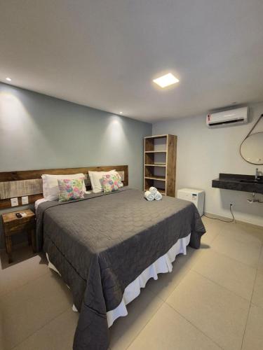 a bedroom with a large bed in a room at Terra Bella Pousada in Morro de São Paulo