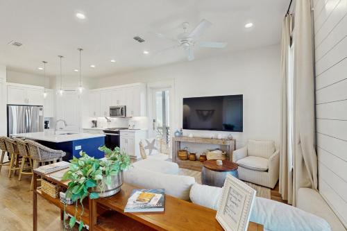 a living room with a couch and a table at Fairway to Heaven in Port Aransas
