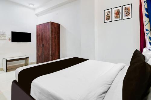 Ένα ή περισσότερα κρεβάτια σε δωμάτιο στο Hotel O CITY INN