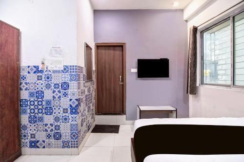 Μια τηλεόραση ή/και κέντρο ψυχαγωγίας στο Hotel O CITY INN