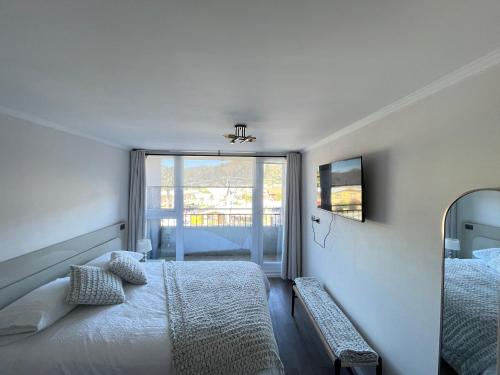 Ένα ή περισσότερα κρεβάτια σε δωμάτιο στο Apartamento en Concepcion con estacionamiento privado