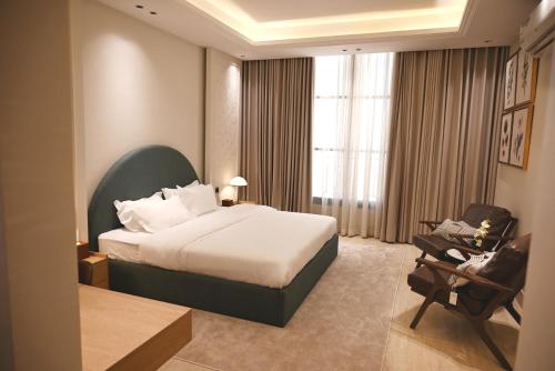 Postel nebo postele na pokoji v ubytování Najd Hospitality - AlQairawan