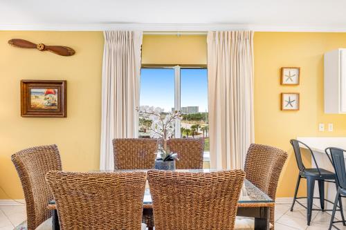 a dining room with a table and chairs at Marlin Key 3A in Orange Beach