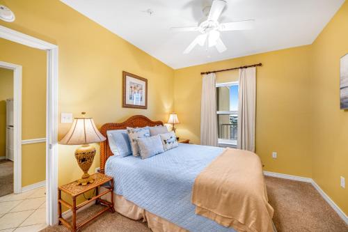 a bedroom with a bed and a ceiling fan at Marlin Key 3A in Orange Beach