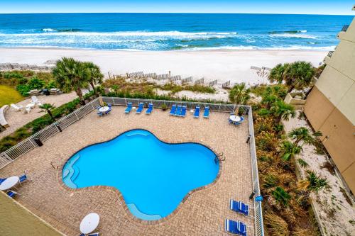 an overhead view of a swimming pool and the beach at Marlin Key 3A in Orange Beach