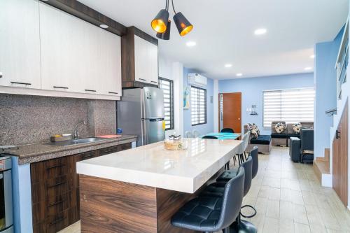 a kitchen with a large white counter in a room at Casa Hermosa Privada in Salinas