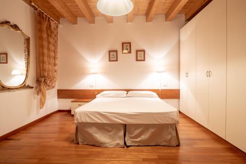 Postel nebo postele na pokoji v ubytování B&B Corte Barbieri