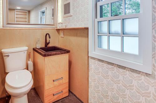 a bathroom with a toilet and a sink at Burlington Escape By Lake Champlain and Bike Path in Starr Farm Beach