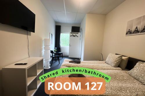 a room with two beds in at Rentalux Apartment Rooms in Timrå