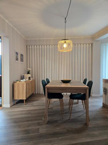a dining room with a table and chairs at Cozy Dot Apartment in Ponta Delgada