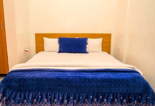 Ένα ή περισσότερα κρεβάτια σε δωμάτιο στο Macchiato Suites Boutique Hotel