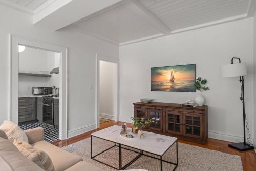 a living room with a couch and a table at The Adaline Room #8 - Beautiful Hyde Park Apt, 2nd Floor, Steps to Bayshore in Tampa