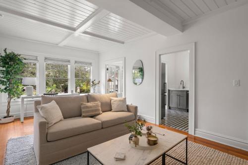 a living room with a couch and a table at The Adaline Room #8 - Beautiful Hyde Park Apt, 2nd Floor, Steps to Bayshore in Tampa