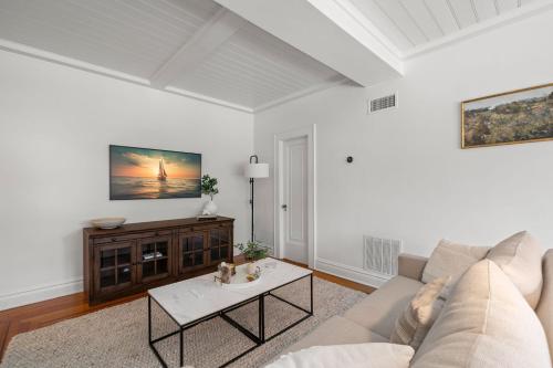 a living room with a couch and a table at The Adaline Room #8 - Beautiful Hyde Park Apt, 2nd Floor, Steps to Bayshore in Tampa